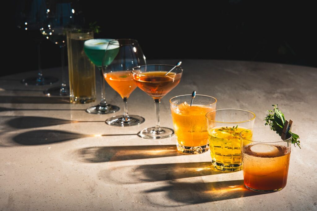 A stylish display of colorful cocktails on a bar counter in Tokyo, Japan. Ideal for nightlife and dining themes.